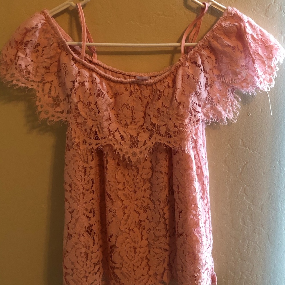 Pink lacy shoulder showing shirt